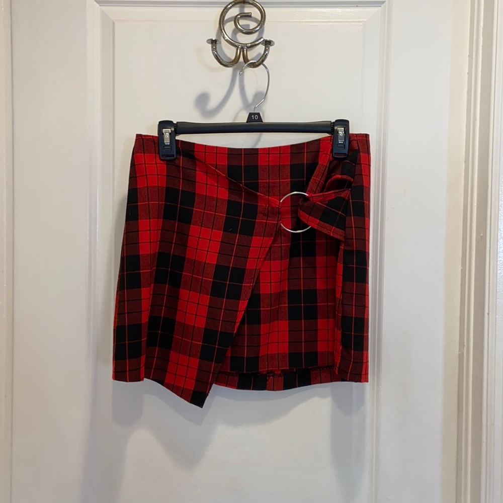 Red and black plaid skirt with ring accessory